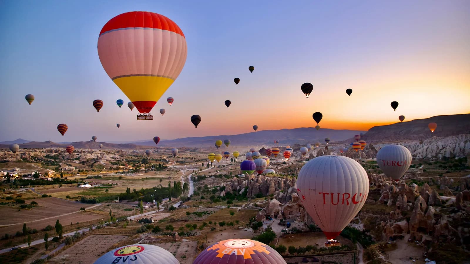 View of hot air balloons rising about Cappadocia, Turkey
